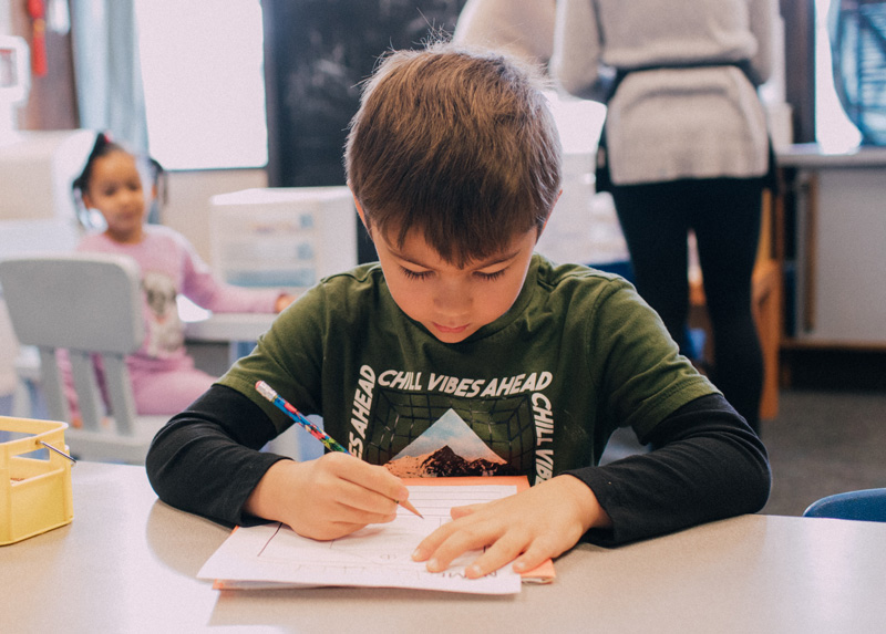 Photo: Young student working on an assignment in the EEU at the Haring Center.